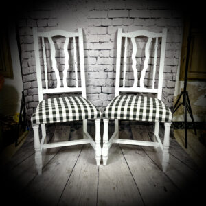 2 white B&W check chairs