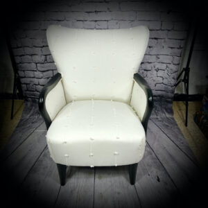 white armchair with black arms 240507