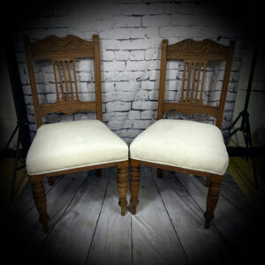 2 beige wooden chairs 250613